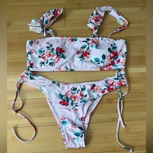 Ruffled bikini with skimpy tie side higher leg bottom